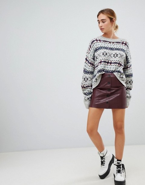 With printed loose sweater and white and black lace up platform boots