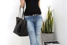With sleeveless top, black tote bag and black boots