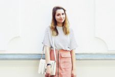With striped loose shirt and white leather bag