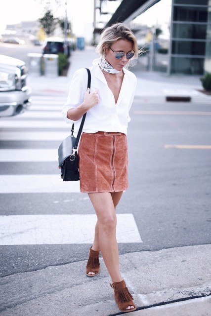 With white button down shirt, black bag and brown suede fringe shoes