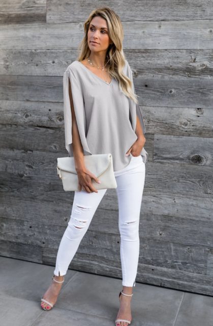 With white distressed pants, white leather clutch and ankle strap shoes