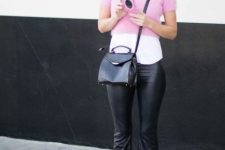 With white shirt, pale pink crop sweater, black bag and boots
