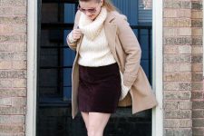 With white sweater, beige coat and brown leather high boots