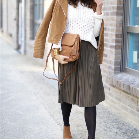 With white sweater, brown jacket, suede boots and bag