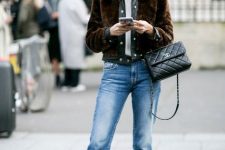 With white t-shirt, brown faux fur jacket, black leather bag and embellished shoes