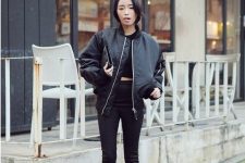 a black cropped tee, skinny pants, a leather bomber jacket, booties and a clutch for the fall