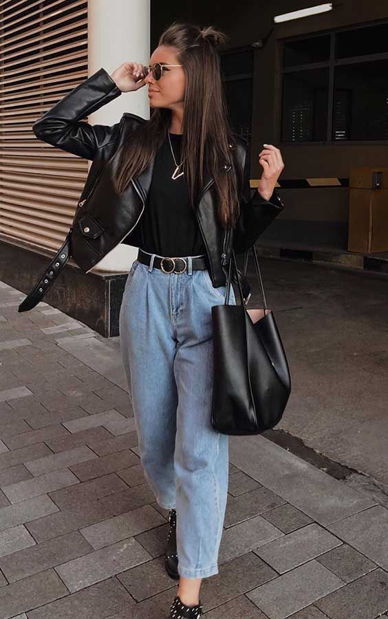 a black tee, light blue slouchy jeans, black booties and a black leather jacket plus a black tote