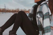 a black turtleneck, black skinnies, combat boots, a plaid shirt jacket for a sexy and chic look