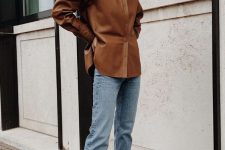 a chic fall look with a brown leather shirt, blue jeans, black square toe heels is easy to compose