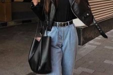 a comfy and chic fall look with a black tee, a black leather jacket, blue slouchy jeans, a tote