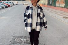 a comfy sporty look with a grey hoodie, a plaid shirt jacket, black skinnies and white trainers