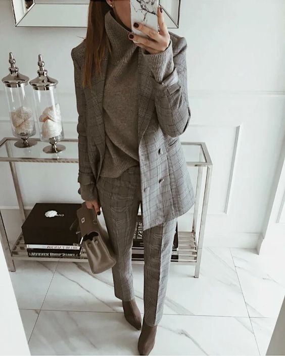 a grey plaid pantsuit, a grey oversized turtleneck, taupe boots and a grey bag for the fall