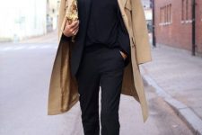 a minimalist work look with a black top, a black suit, a camel coat and burgundy pointed toe booties