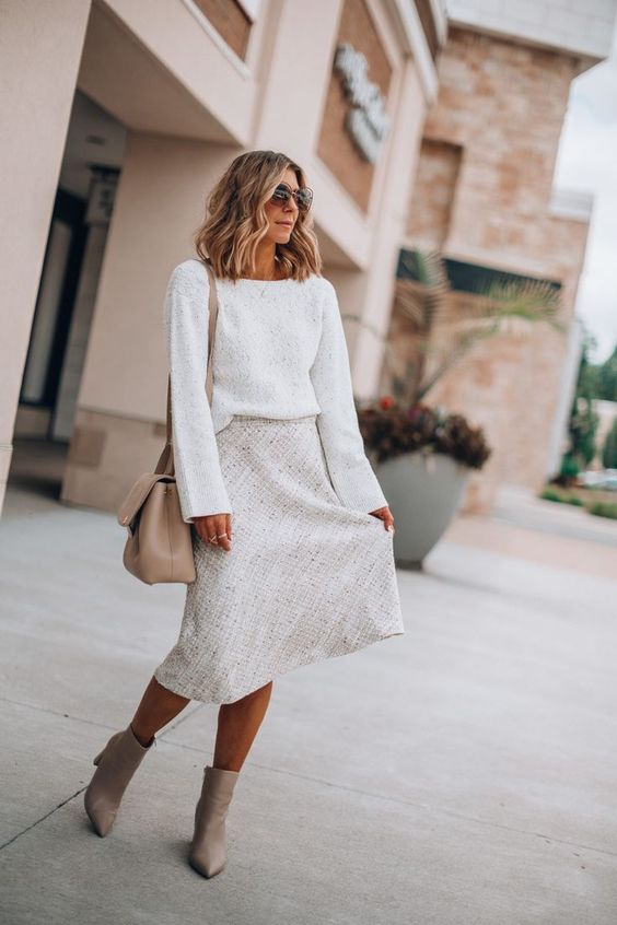 a white top, a white tweed midi skirt, a tan bag and tan booties for a romantic fall look