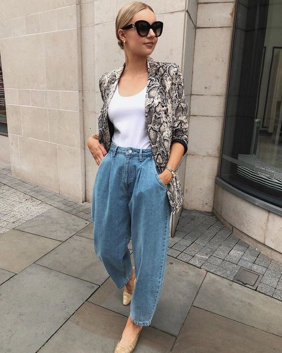 a white top, blue jeans, a snake print blazer and snakeskin shoes for a trendy and chic look