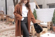 a white turtleneck, graphite grey jeans, brown booties, a brown coat and a bag