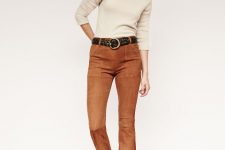 With beige sweater, black belt and brown suede boots