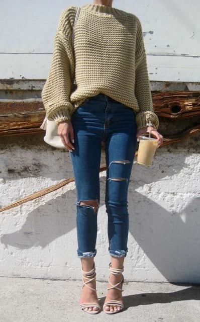 With beige sweater, white bag and lace up high heels