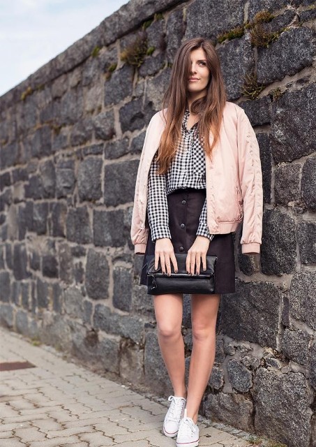With black and white checked shirt, black button front skirt, clutch and white sneakers