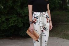 With black t-shirt, brown clutch and brown suede pumps