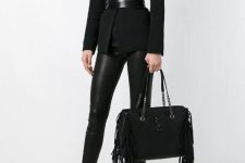 With black top, black blazer, leather belt, leather trousers and black pumps