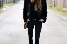 With faux fur jacket, brown bag, skinny pants and lace up boots