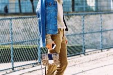 With gray shirt, denim jacket, leopard printed bag and silver high heels