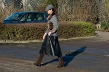 With gray sweater, brown suede boots and leather skirt