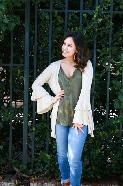 With olive green loose top and cropped jeans