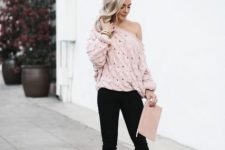 With pale pink clutch, black pants and black pumps