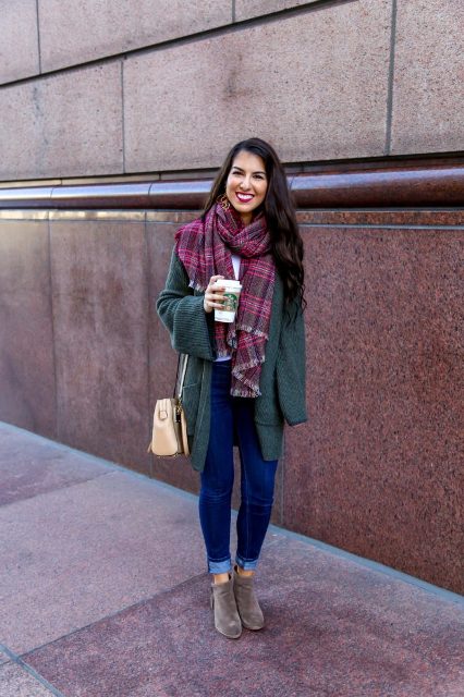 With plaid scarf, beige bag, cuffed jeans and gray suede ankle boots