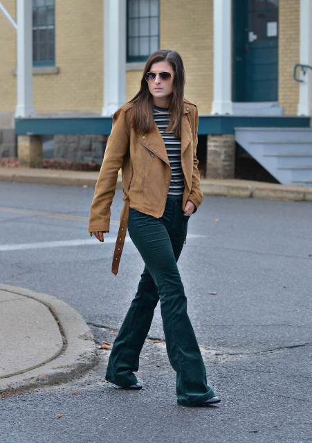 With striped shirt, brown suede jacket and black boots