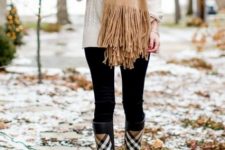 With white sweater, beige fringe scarf and black leggings