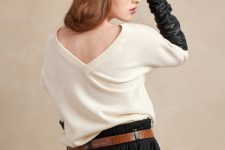 With white sweater, brown belt, black pleated skirt and gloves