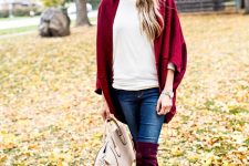 With white t-shirt, beige leather bag, navy blue jeans and marsala cardigan