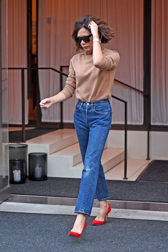 a camel turtleneck, blue ripped mom jeans, red heels for a cool and simple fall look