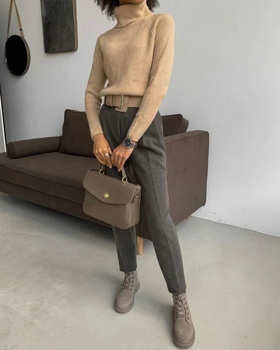 a camel turtleneck, grey pants, taupe boots and a taupe bag for a business casual look