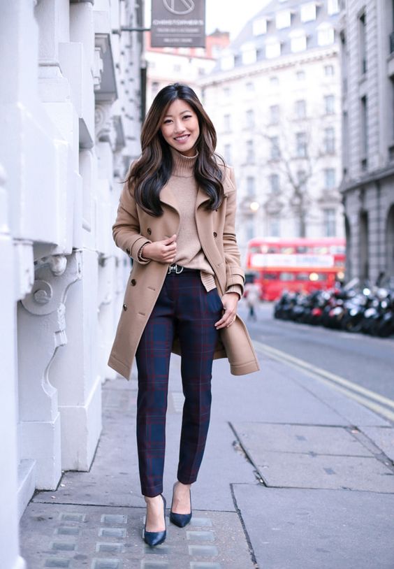 a camel turtleneck, navy and red plaid pants, navy shoes, a camel coat and a bag