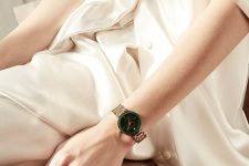 a minimalist look in neutrals finished with a copper bracelet watch with a green frame is a stylish idea