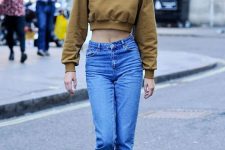a rust-colored cropped sweatshirt, blue high waisted jeans, silver brogues for every day