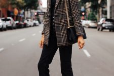 a simple look with a black tee, black high waisted jeans, a statement plaid blazer, nude heels and a black bag