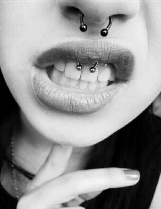 a smiley and septum piercing done with the same jewelry pieces for an edgy touch