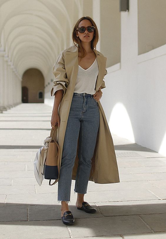 a white t-shirt, blue jeans, black mules, a neutral trench and a two tone bag to rock right now