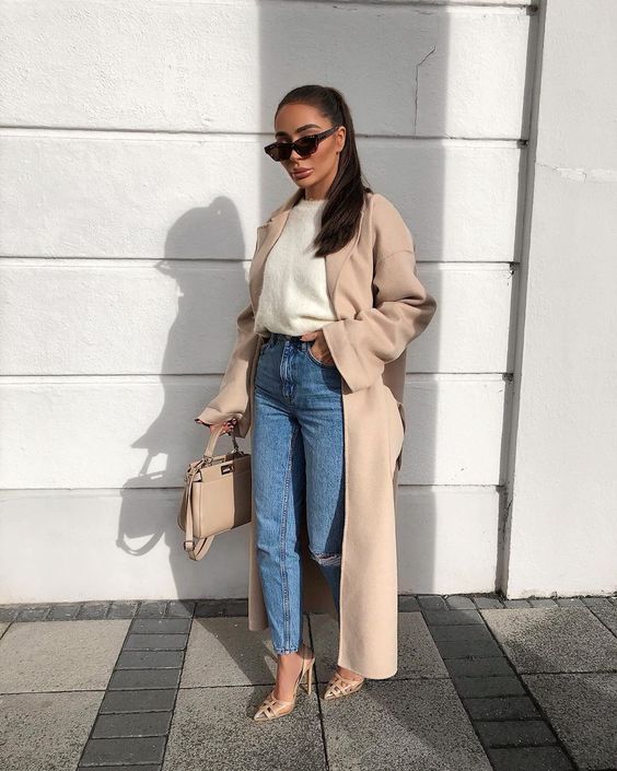 a white top, blue jeans, tan striped shoes, a tan duster and a tan bag for a chic work look