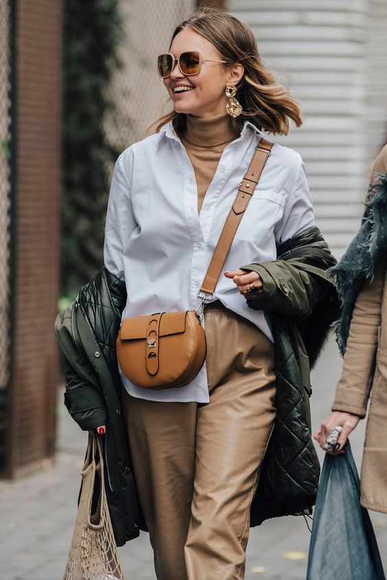 a camel turtleneck outfit with leather pants