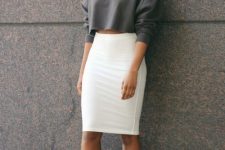 an oversized graphite grey cropped sweatshirt, a white pencil skirt, white trainers for a sexy look