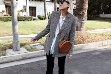 black skinnies, white sneakers, a white oversized shirt and an oversized plaid blazer plus a round bag
