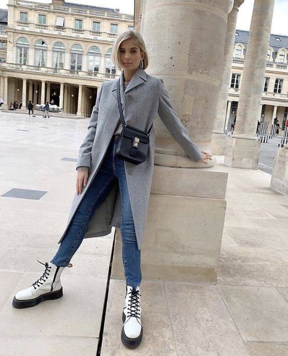 blue jeans, a grey coat, white combat boots and a black bag for the fall