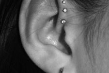 elegant ear styling with a hoop in the lobe, studs in the flat and forward helix