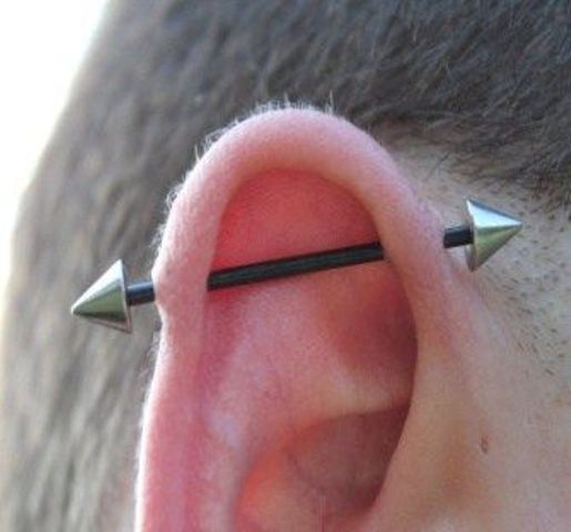 finish your industrial piercing with a catchy arrow barbell and make your look bolder